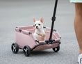Load image into Gallery viewer, Poussette pliante pour chien rose avec petit chien blanc assis à l'intérieur et poignée de traction