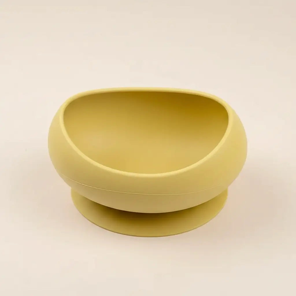 Gamelle en silicone avec ventouse jaune, pour chat et petit chien, stabilité et praticité.