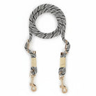 Laisse mains libres chien Oscar et Plume corde noire et blanche avec attaches métalliques dorées