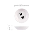 Assiette en céramique pour chat blanche avec empreintes de pattes noires et dimensions 10,5 cm de diamètre