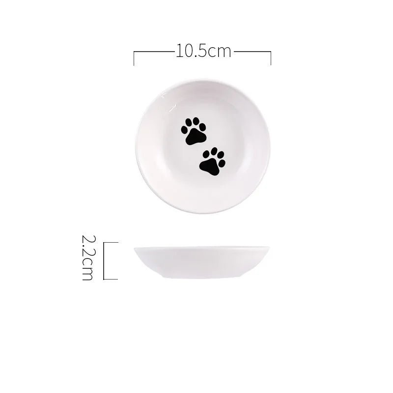 Assiette en céramique pour chat blanche avec empreintes de pattes noires et dimensions 10,5 cm de diamètre
