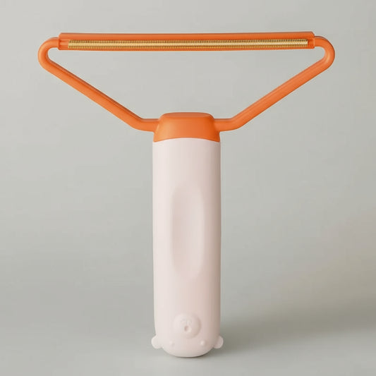 Brosse attrape poils chat et chien Oscar et Plume avec manche ergonomique orange et blanc