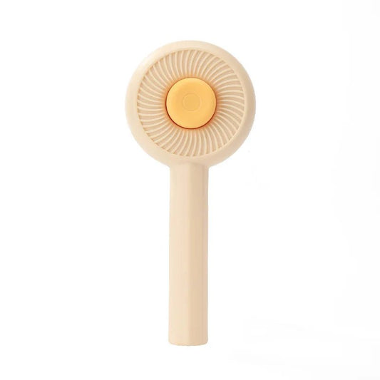 Brosse poils chat beige avec poignée ergonomique pour un toilettage facile et efficace