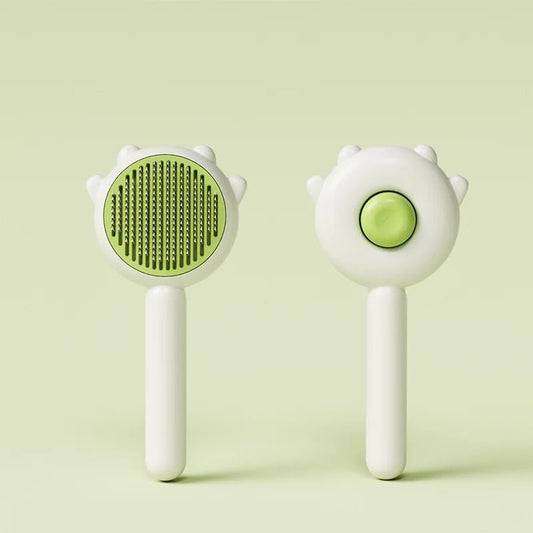 Brosse poils chat Oscar et Plume blanche avec poils verts et ergonomique pour un toilettage facile