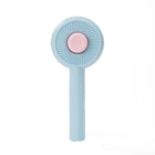 Brosse poils chat bleue de Oscar et Plume avec design compact et forme ronde pour un toilettage efficace