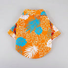 Chemise de plage pour chien Oscar et Plume avec motif tropical orange, bleu et blanc