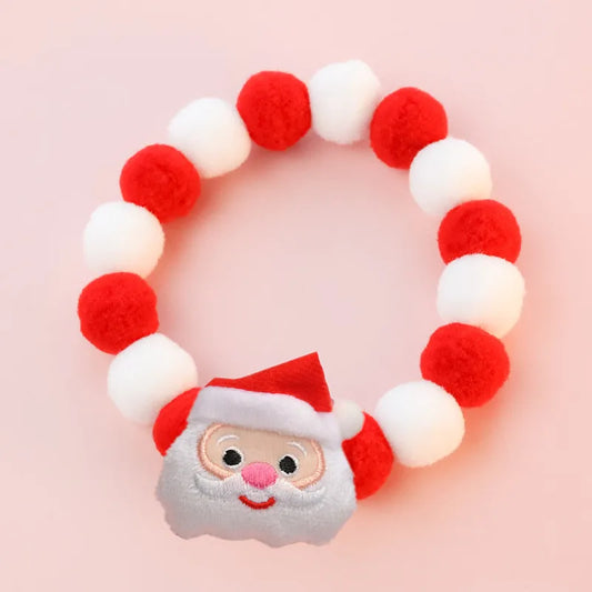 Collier de Noël pour chat et chien avec des pompons rouges et blancs et un motif de père Noël amusant