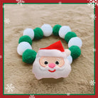 Collier de Noël pour chat et chien avec un motif de Père Noël et des pompons colorés
