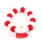 Collier de Noël pour chat et chien avec pompons rouges et blancs et un petit chapeau de Noël