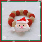 Collier de Noël pour chat et chien avec un motif de Père Noël amusant et des pompons colorés