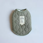 Manteau chaud pour chien vert olive matelassé avec doublure en fausse fourrure signé Oscar et Plume