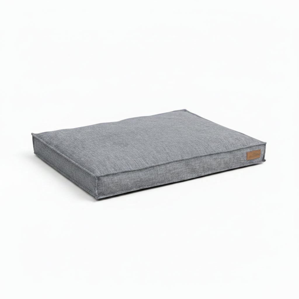 Coussin Pour Chien confortable en tissu gris, parfait pour le repos de votre animal