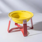 Gamelle céramique surélevée chat jaune avec support rose pour un repas confortable