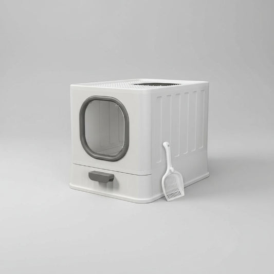 Bac à litière design chat blanc avec pelle assortie dans un salon moderne