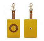 Distributeur de sac à déjections pour chien en tissu jaune avec attache métal par Oscar et Plume