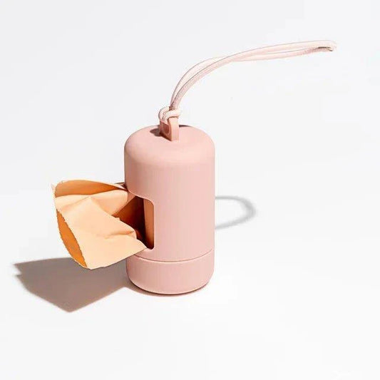 Distributeur de sacs pour chien rose compact avec sangle de transport pratique