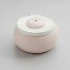 Fontaine à eau pour chat design ronde en rose pastel avec eau filtrée en circulation