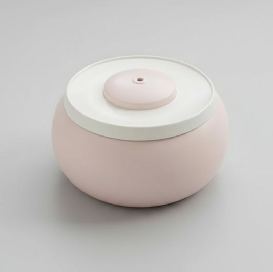 Fontaine à eau pour chat design ronde en rose pastel avec eau filtrée en circulation