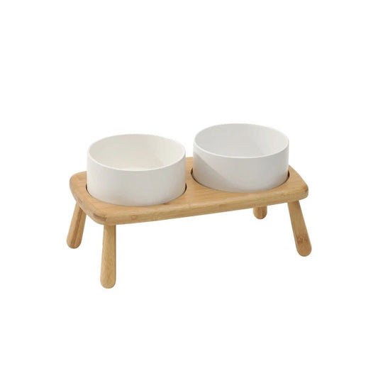 Gamelle céramique chien double posée sur support en bois naturel avec pieds