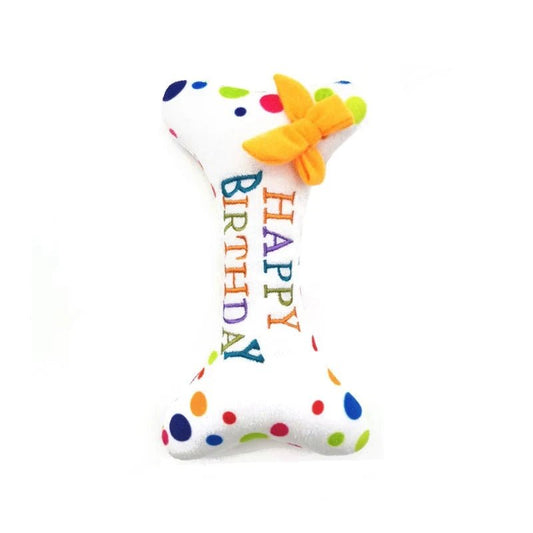 Jouet anniversaire pour chien en forme d'os blanc avec pois colorés et inscription Happy Birthday