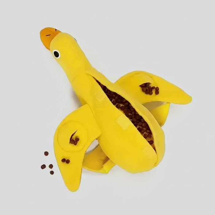 Jouet distributeur de croquettes pour chien en forme de canard jaune avec des croquettes à l'intérieur