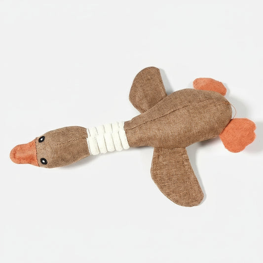 Jouet sonore oie chien en tissu naturel, idéal pour les jeux et la stimulation auditive des animaux.