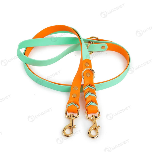 Laisse mains libres pour chien Oscar et Plume en silicone orange et turquoise avec mousquetons dorés