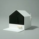 Litière design chat en forme de maison moderne avec pelle intégrée et surface blanche minimaliste