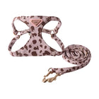 Harnais double crochet pour chien en couleur rose clair à motifs tachetés et avec une laisse assortie