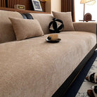 Couverture de protection canapé beige texturée Oscar et Plume sur canapé moderne avec coussins