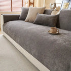 couverture de protection canapé gris texturé Oscar et Plume sur canapé beige avec coussins et tasse