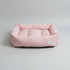 Panier réversible pour chien en tissu à carreaux roses et blancs avec coussins confortables