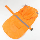 Poncho imperméable pour chien orange avec capuche et bandes réfléchissantes de Oscar et Plume