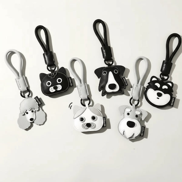 Porte-clés chien en cuir Oscar et Plume avec modèles variés en noir et blanc pour accessoires élégants