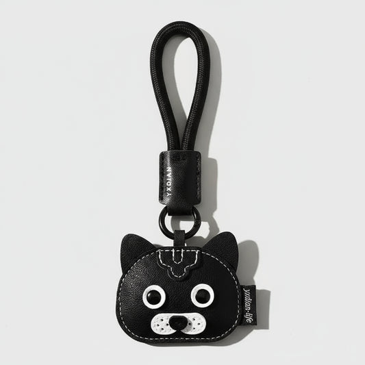 Porte-clés chien en cuir noir avec tête de chien stylisée et boucle pour attacher aux clés