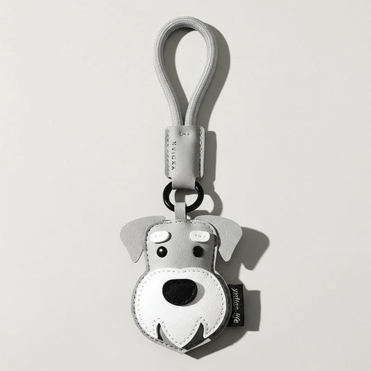 Porte-clés chien en cuir gris clair avec détail blanc et noir par Oscar et Plume