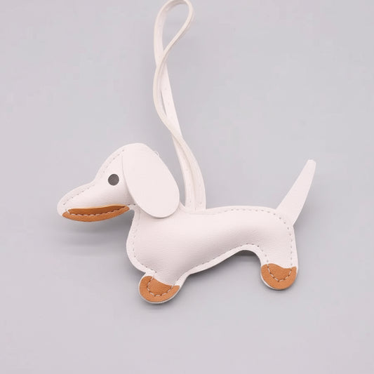 Porte-clés teckel cuir blanc avec détails en cuir marron, idéal pour les amoureux des animaux