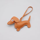 Porte-clés teckel cuir en forme de chien marron avec yeux en plastique pour les amoureux des animaux