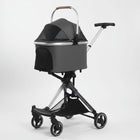 Poussette pliable pour chien Oscar et Plume avec coque grise et cadre noir à quatre roues