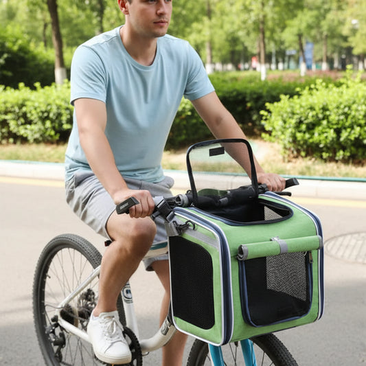 Sac de transport chat et chien Oscar et Plume vert fixé au guidon d'un vélo pour animaux