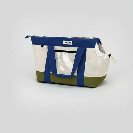 Sac de voyage pour chien et chat Oscar et Plume bleu blanc et vert avec chat orange allongé à côté