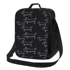 Sac isotherme design chien noir avec motifs chiens blancs et bandoulière ajustable