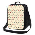 Sac isotherme design chien avec motifs colorés et bandoulière noire pratique