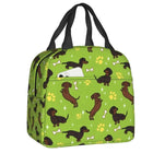 Sac isotherme teckel avec un motif amusant de chiens sur fond vert pour les promenades et les pique-niques
