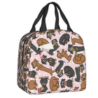Sac isotherme teckel avec motifs amusants de chiens sur fond rose, idéal pour les pique-niques