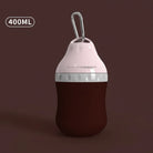 Gourde de voyage pour chien de 400ML avec design ergonomique et clip de transport pratique.