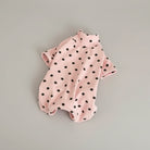 T-shirt en coton doux pour teckel à pois noirs sur fond rose, confortable et élégant