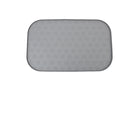 Tapis en silicone pour gamelle chien avec motif de pattes antidérapant et surface facile à nettoyer