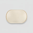 Tapis silicone gamelle chien beige avec motifs pattes pour un espace repas propre et antidérapant