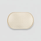 Tapis silicone gamelle chien beige avec motifs pattes pour un espace repas propre et antidérapant